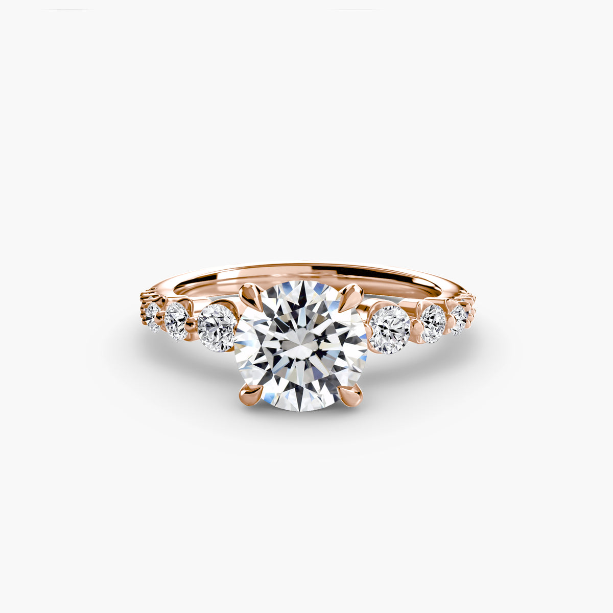 Solitaire with tapered side stones & pave details