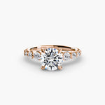 Solitaire with tapered side stones & pave details