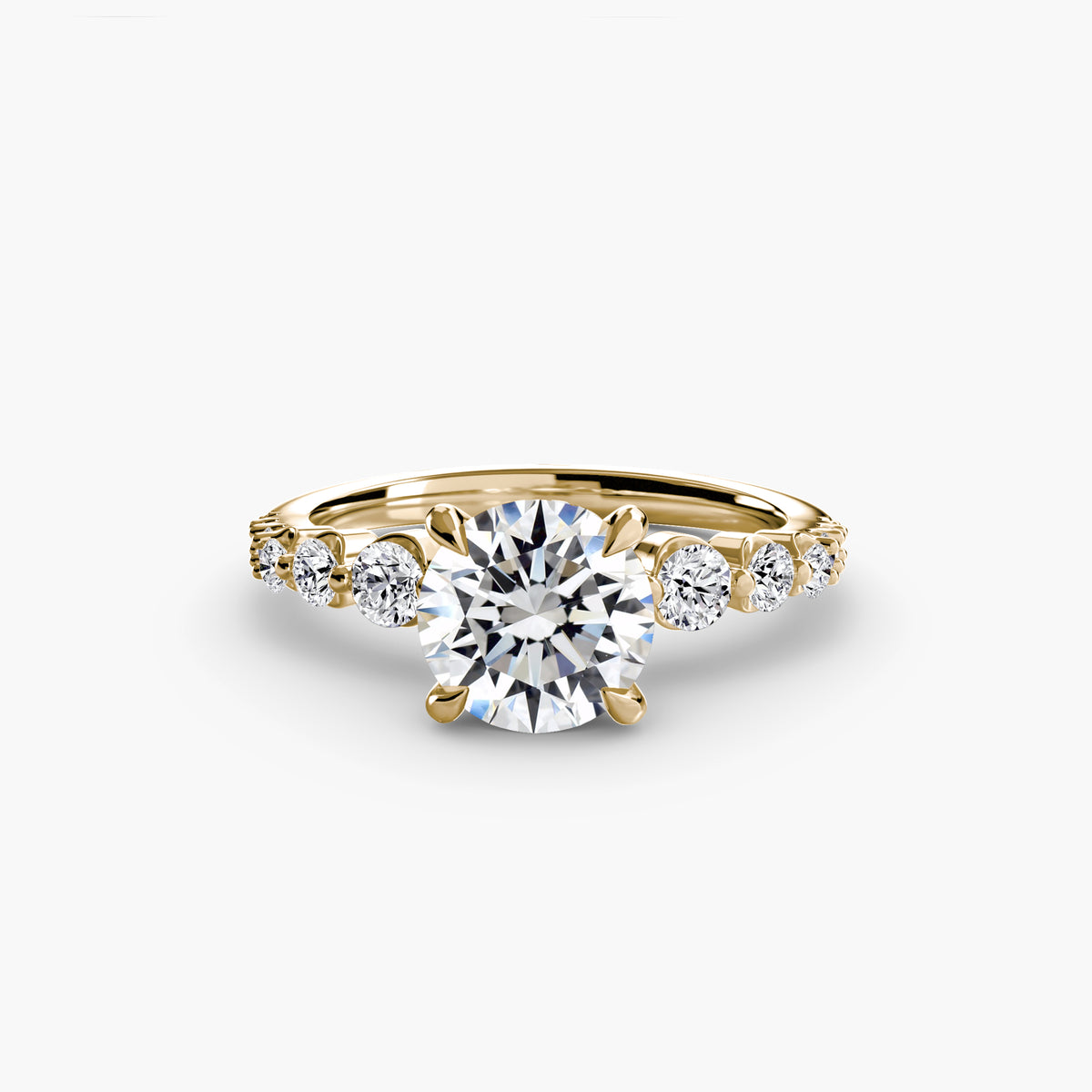 Solitaire with tapered side stones & pave details