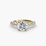 Solitaire with tapered side stones & pave details