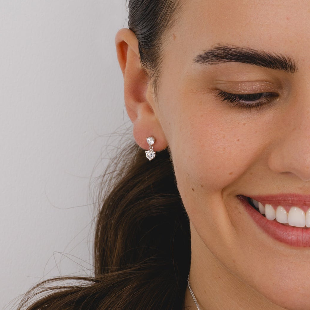 pendant earrings with two round cubic zirconia gemstones in three clawed silver settings
