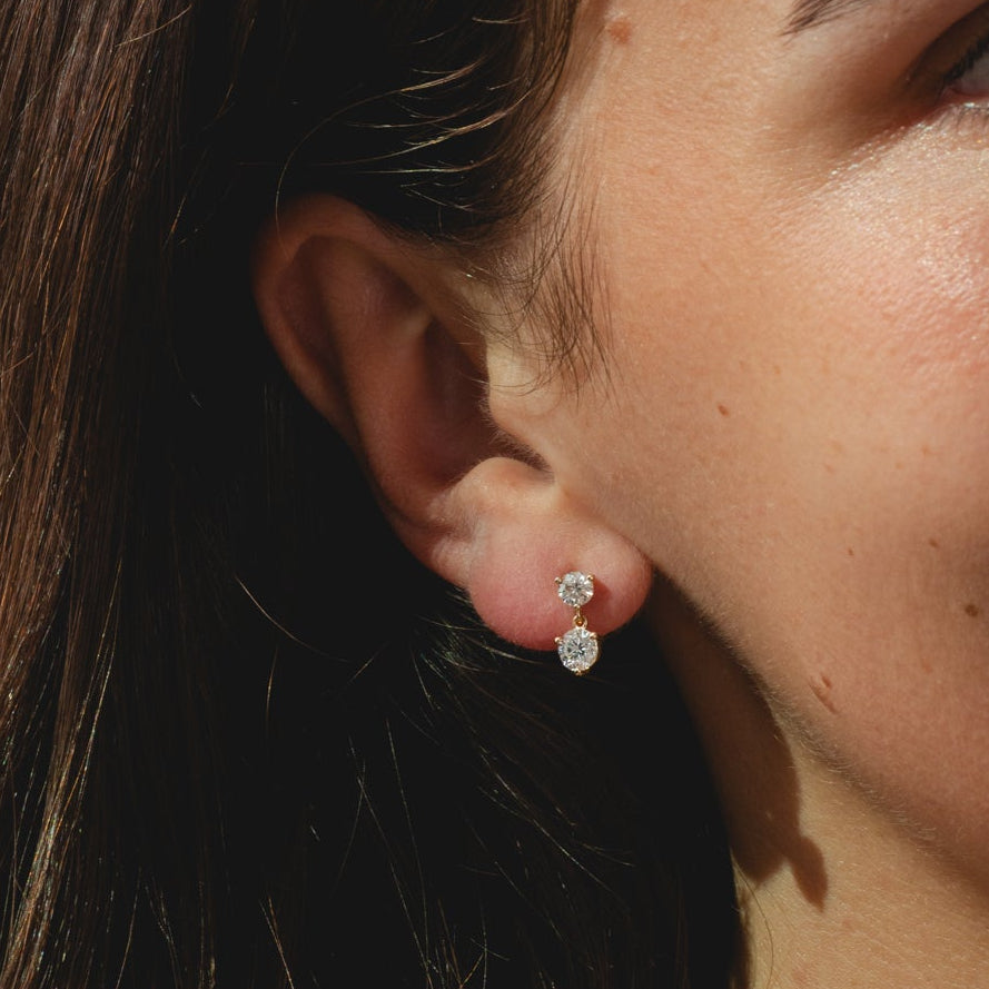 9ct gold stud drop earrings with tworound-cut 1.10ct diamonds each.