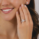 A pear cut diamond solitaire ring in a four claw platinum setting.