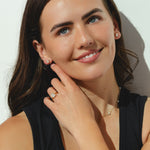 gold hoop earrings with oval-cut 0.84ct diamonds in a bezel setting.