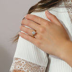 solitaire ring featuring a round cut 3ct diamond set in a yellow gold four prong band.