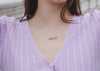 lilywho model wearing a silver bar necklace with handwritten engraving