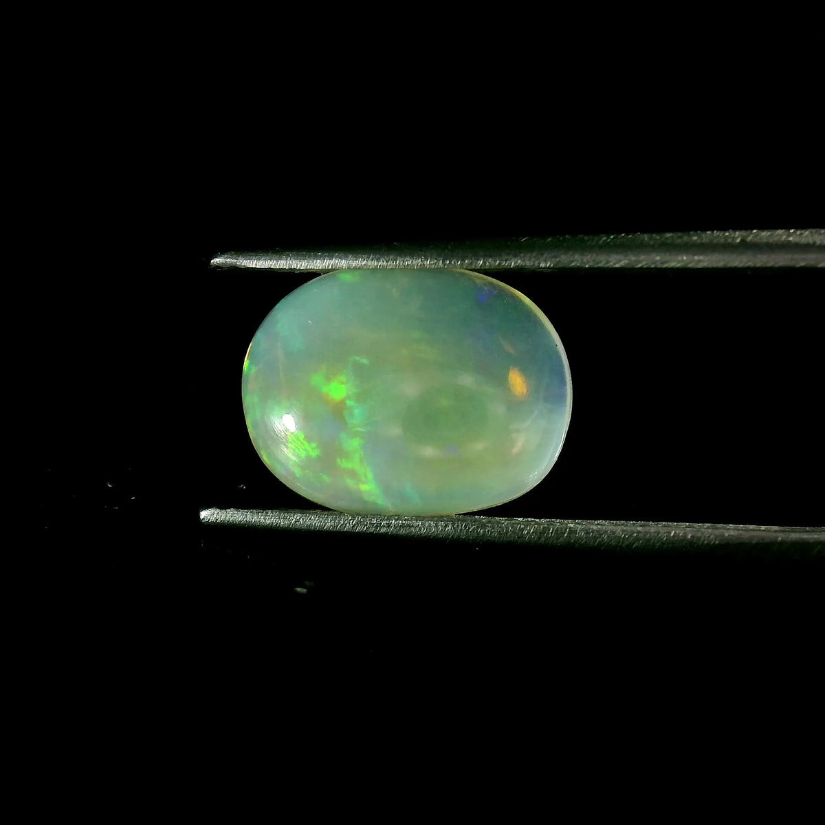 2.97ct Oval Natural Opal (Colour White, Clarity Moderately Included, Cut Cabochon)