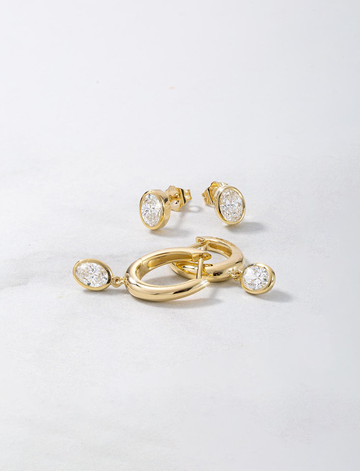 0.84ct 9ct Gold Oval Lab Diamond Bezel Hoop Earrings