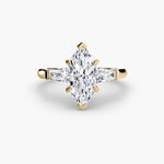 Solitaire Ring with tapered Baguettes