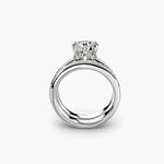 Solitaire Ring with Baguette Channel