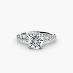 Solitaire with tapered side stones & pave details