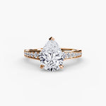 Solitaire with channel set side stones