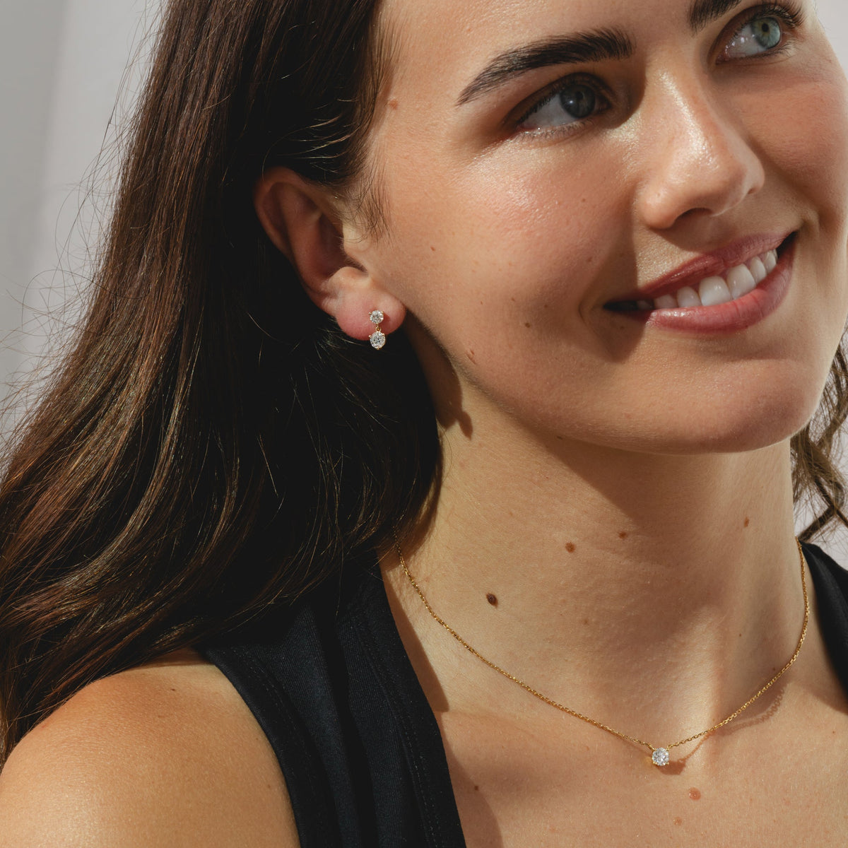 9ct gold stud drop earrings with tworound-cut 1.10ct diamonds each.