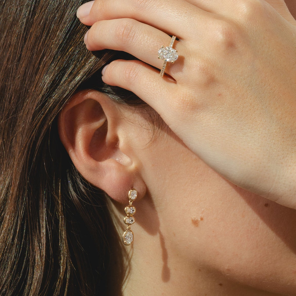 9ct gold drop earrings with four cascading oval-cut 1.78ct diamonds.