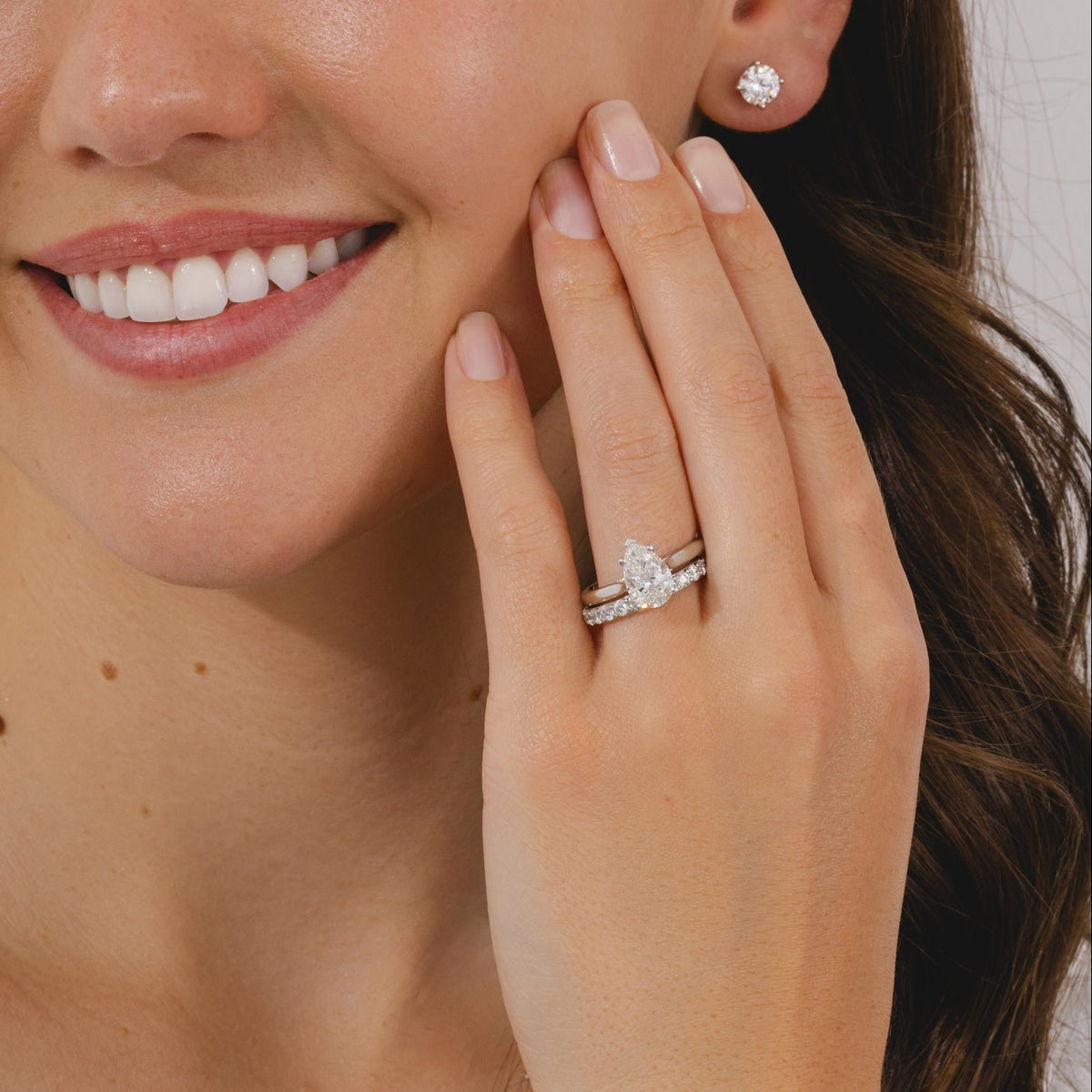 A pear cut diamond solitaire ring in a four claw platinum setting. 