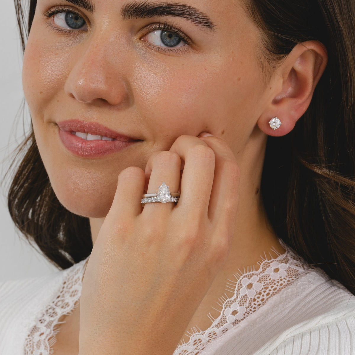 A pear cut diamond solitaire ring in a four claw platinum setting. 
